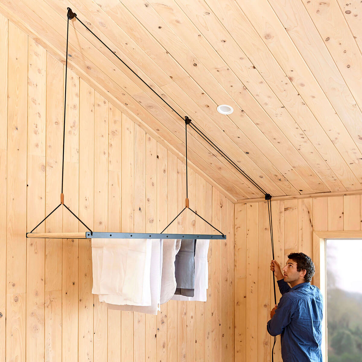Black clothes hanging drying rack