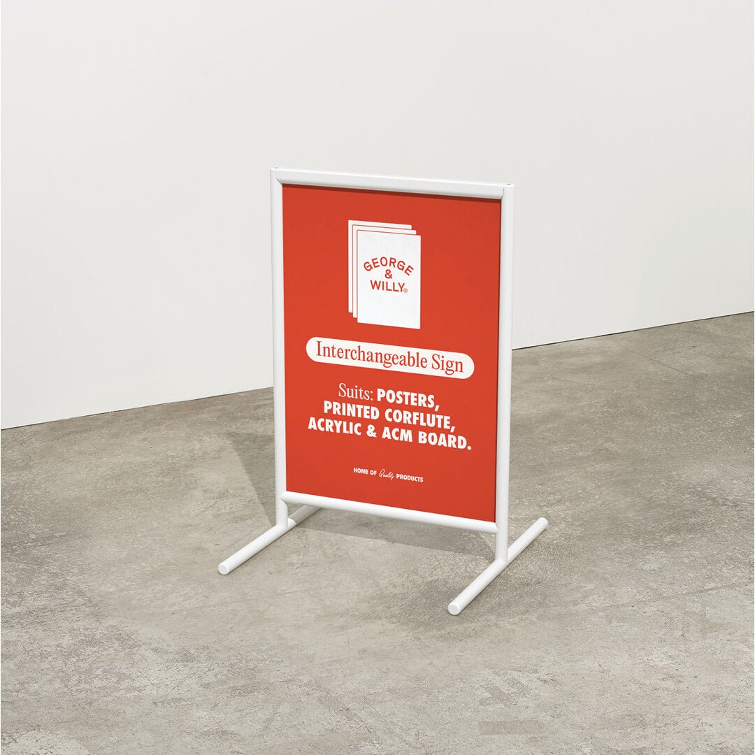 white framed poster sidewalk sandwich board sign with red poster inside