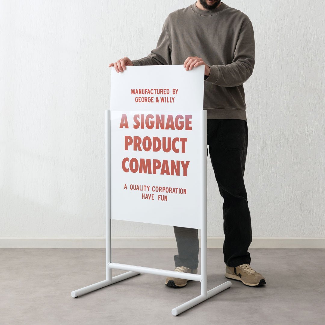 white frames poster sidewalk business sign with person inserting poster