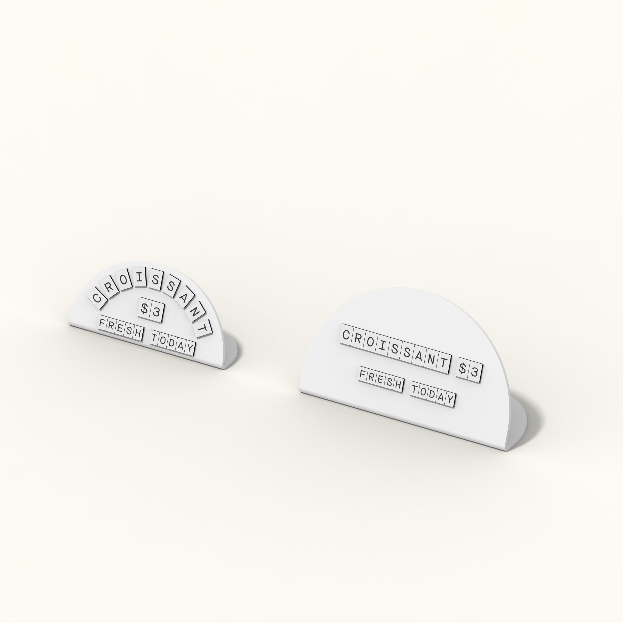 white round counter signs with white tiled letters on a countertop