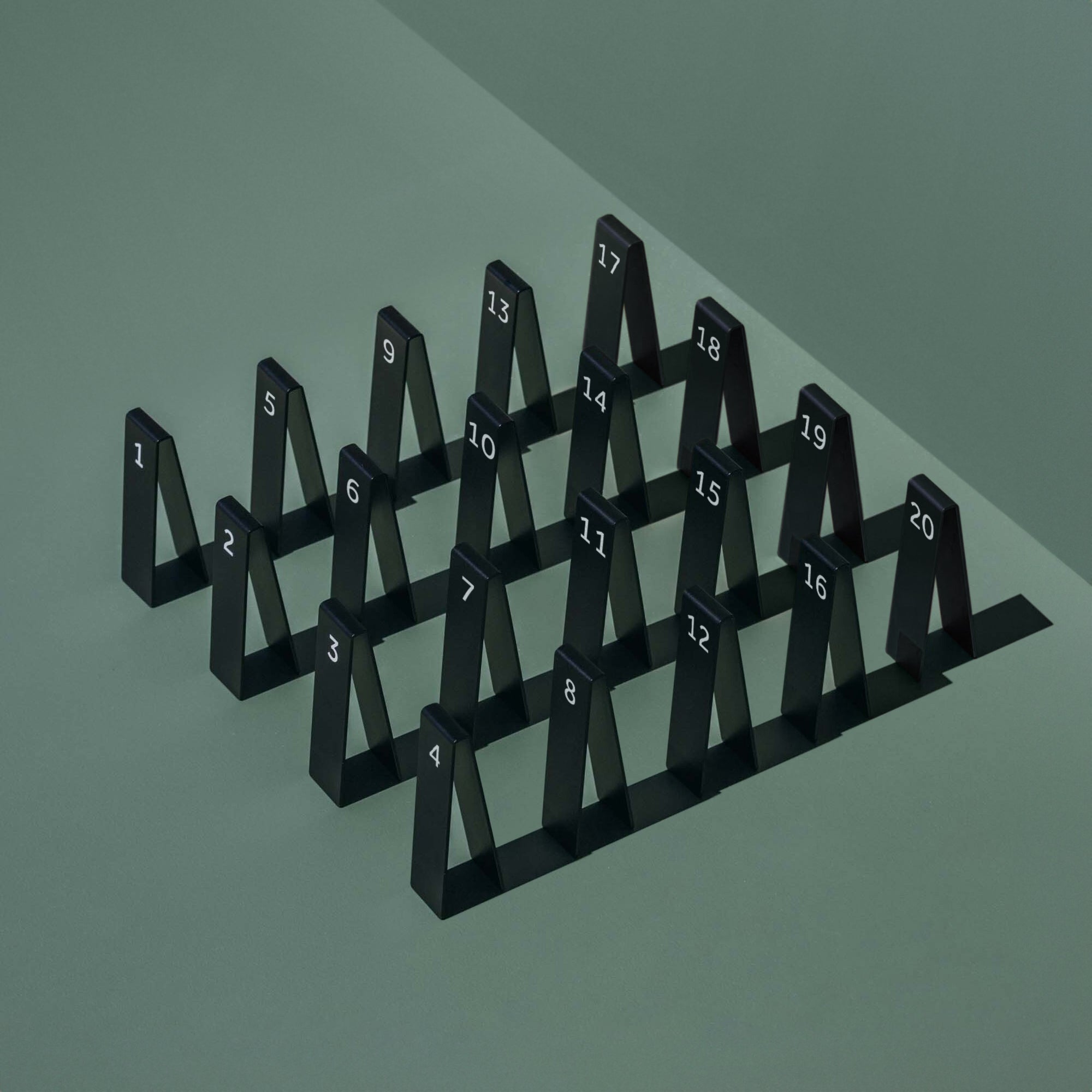 flat lay of the set of 20 table number stackers in black