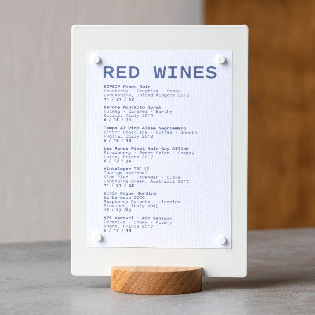 white table talker on a tabletop displaying wine menu