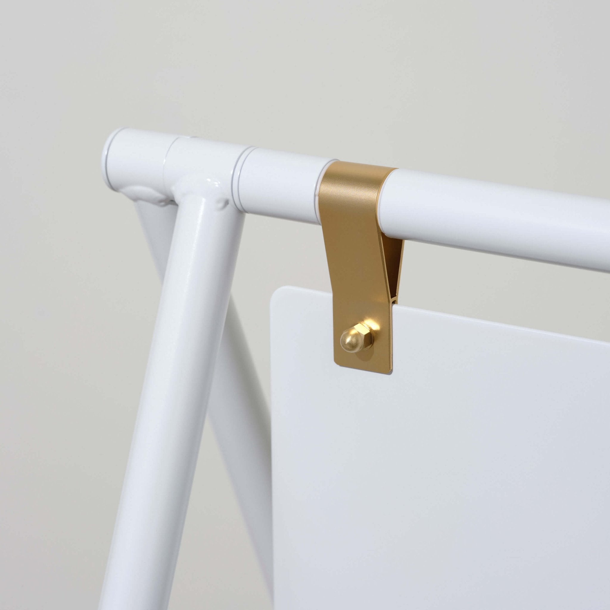 Close-up of blank white a-frame sandwich board sign gold hinges and aluminum frame construction
