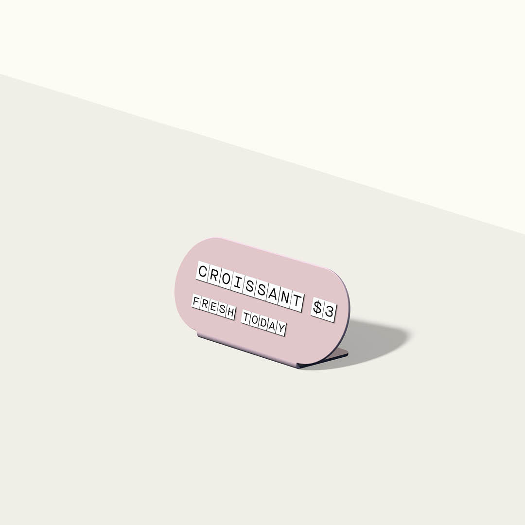 render of pink curve pill-shaped counter display sign