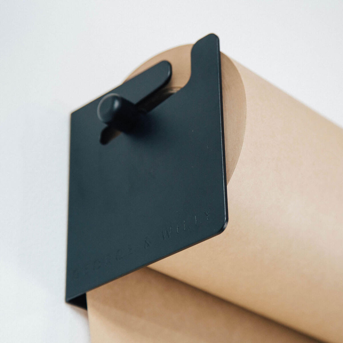 close up detail of the kraft paper in the studio roller holder
