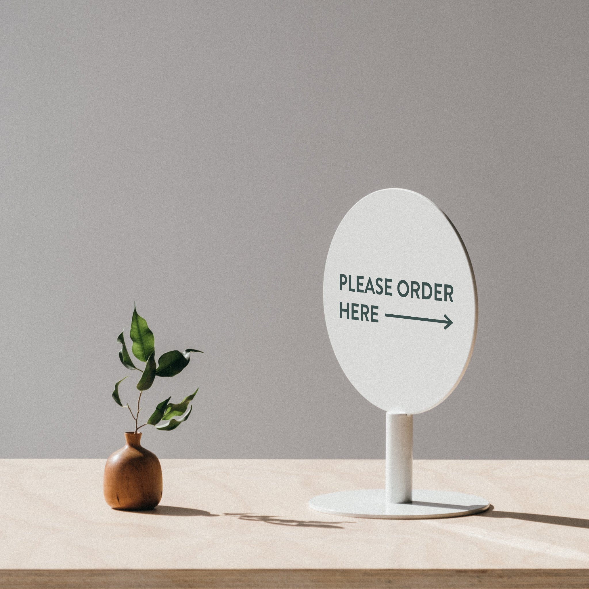 Small white lollipop sign