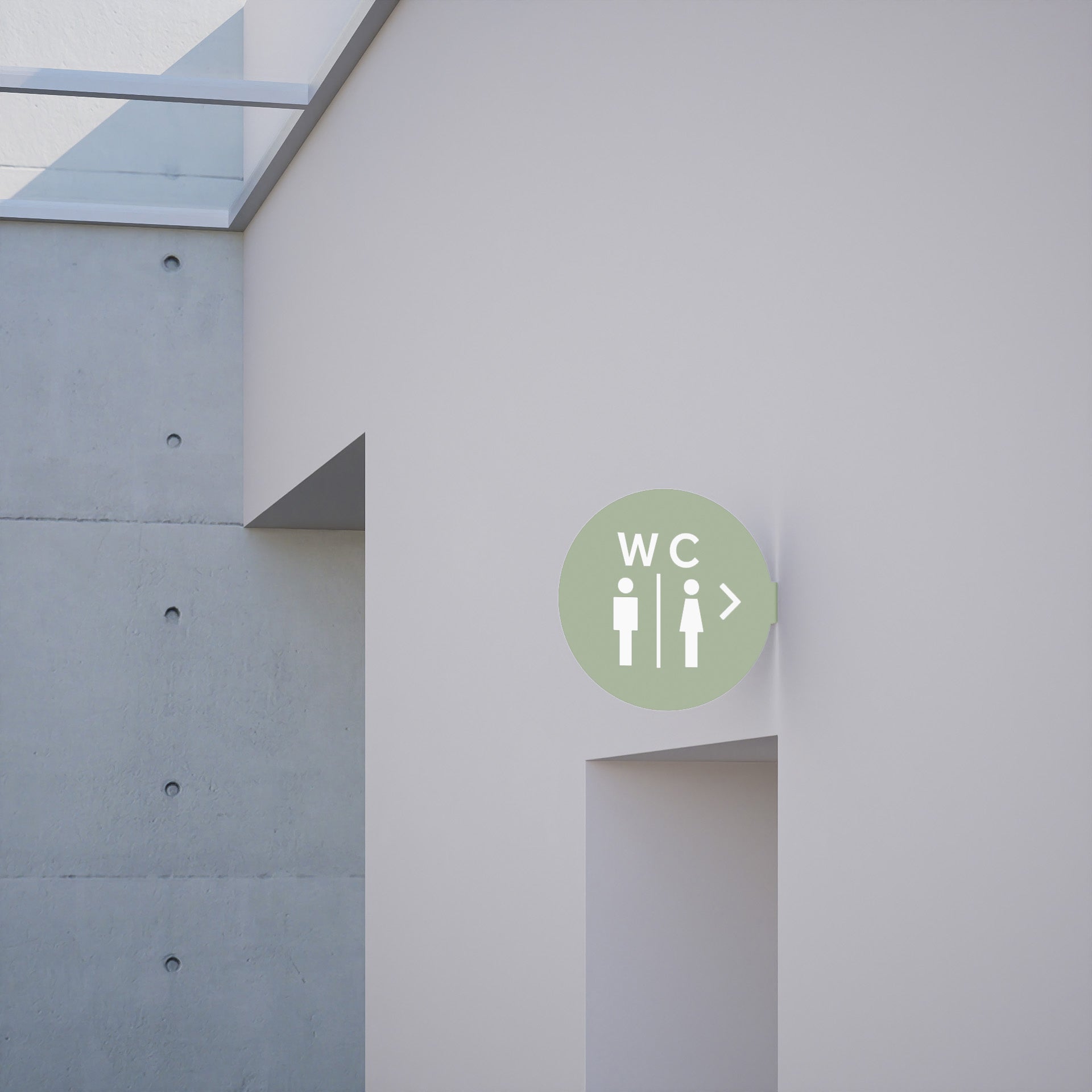 sage green circle blade wall sign with toilet decal applied to be a bathroom sign, installed on a wall