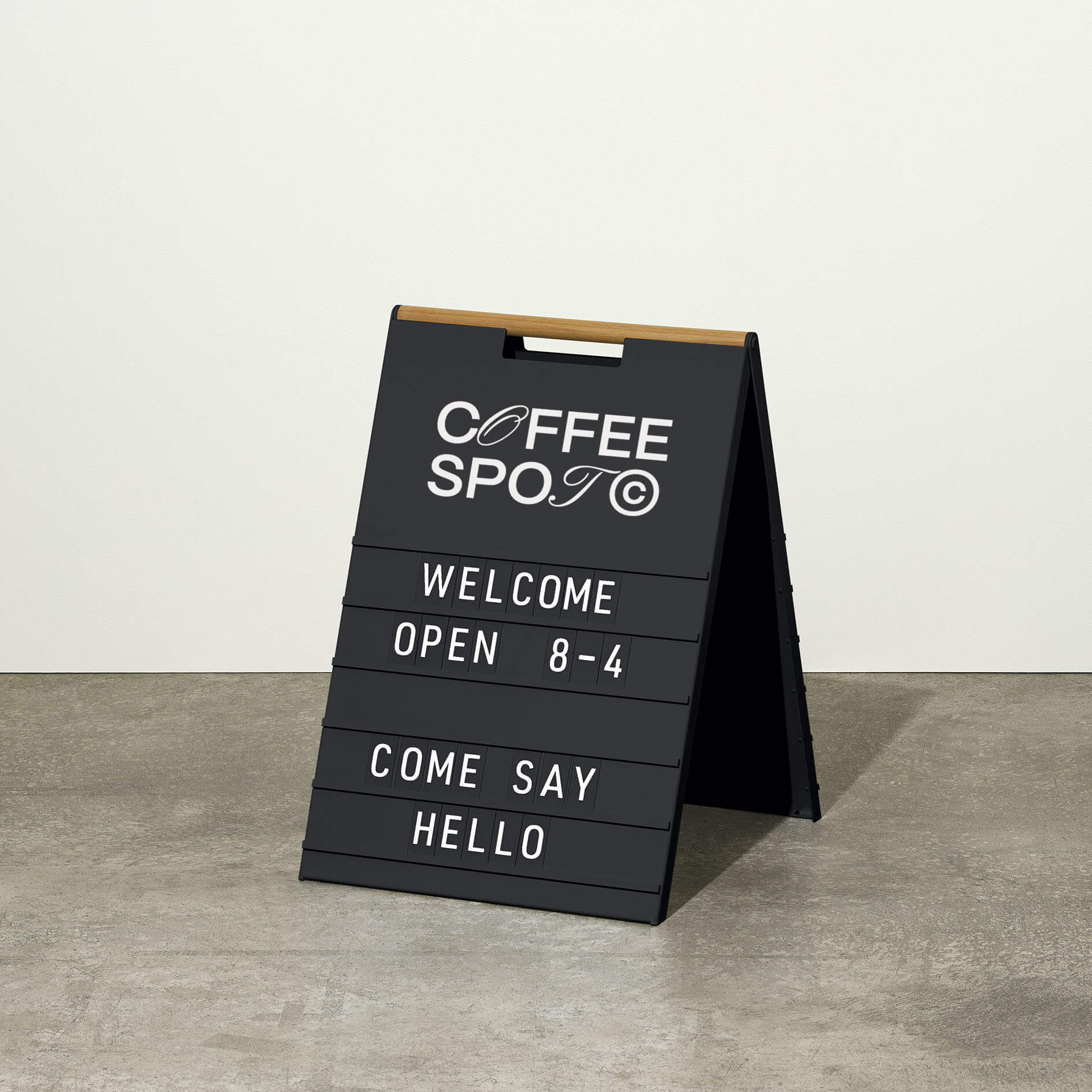 black letter sidewalk sign inside a studio with message displayed