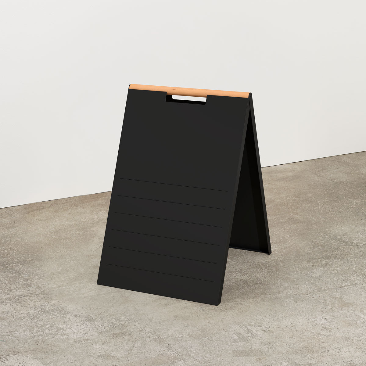 plain black magnetic letter sidewalk sign in a studio