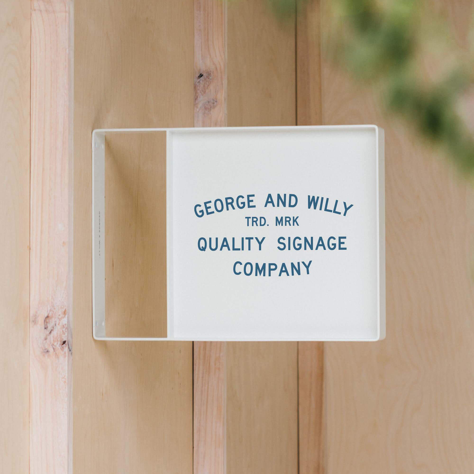 white square panel sign with george & willy branding applied